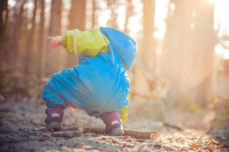 child_in_nature.jpg child playing in the dirt