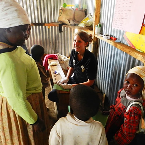 Volunteer Helping Family in Kenya