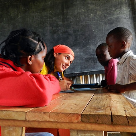 Volunteer Sat Down Teaching in Kenya