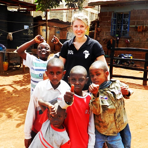 Volunteer With Small Group of Children in Kenya
