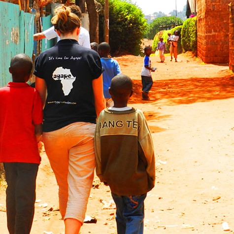 Volunteer Walks With Children in Kenya
